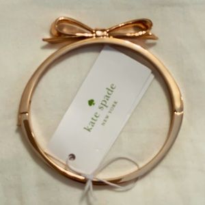 Kate Spade rose gold bangle w/ bow & hinge closure